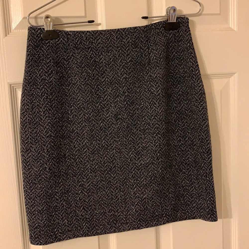 Bryan’s gray skirt